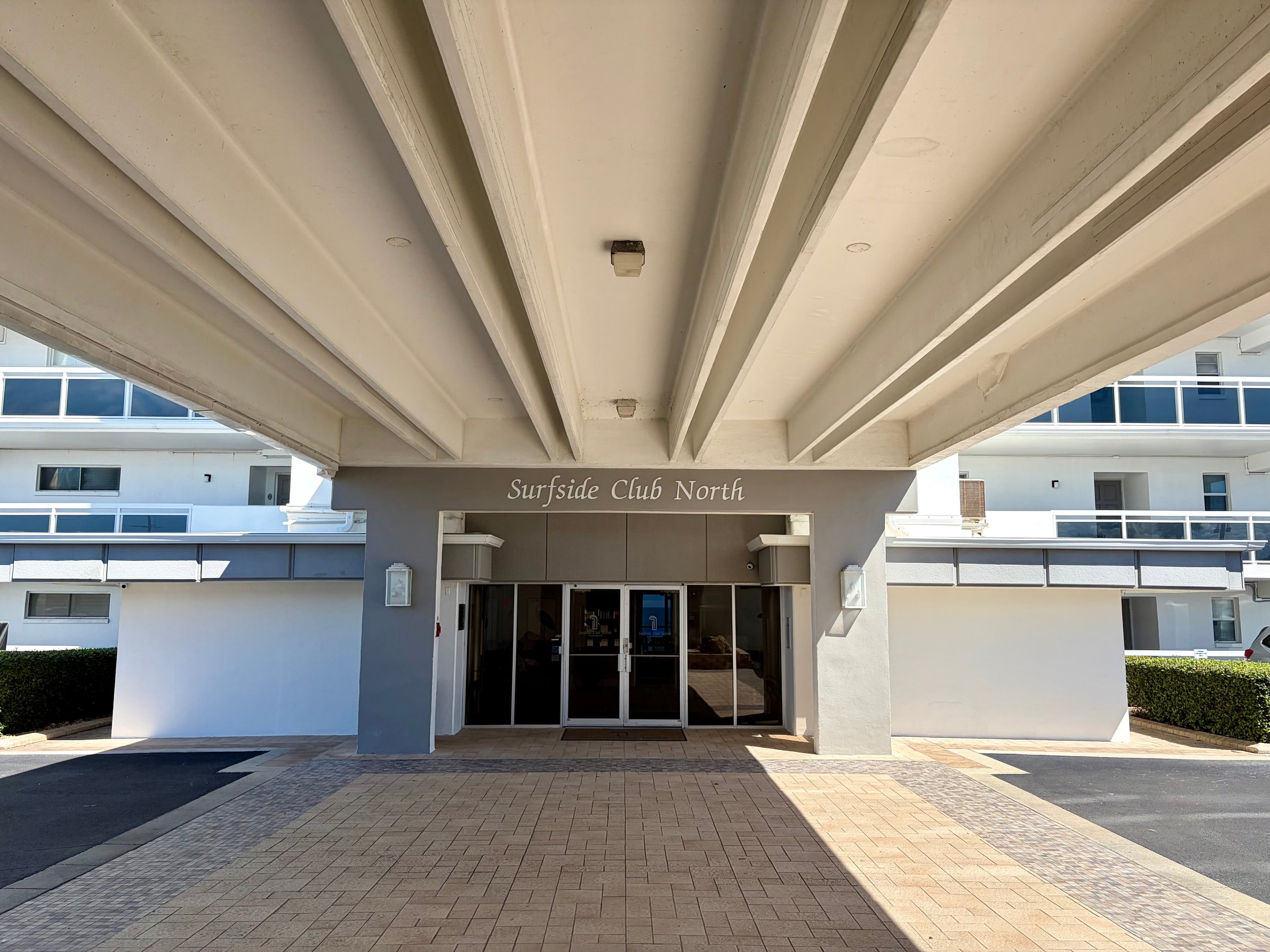 Front doors and covered drive at Surfside Club North